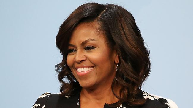 Former First Lady Michelle Obama in professional mode, with a blowout and glamorous waves. Picture: Paul Morigi/Getty Images