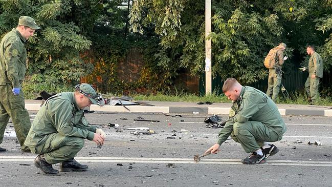 Investigators work on the site of a car bomb that killed Daria Dugina outside Moscow. Picture: AFP