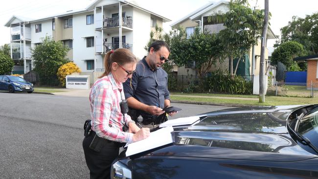 Task Force Guardian personnel, detective senior constable Renee Pavicic and Plain clothes senior constable Clarry Describes make an arrest plan while in the field in Cairns. Picture: Peter Carruthers / File photo