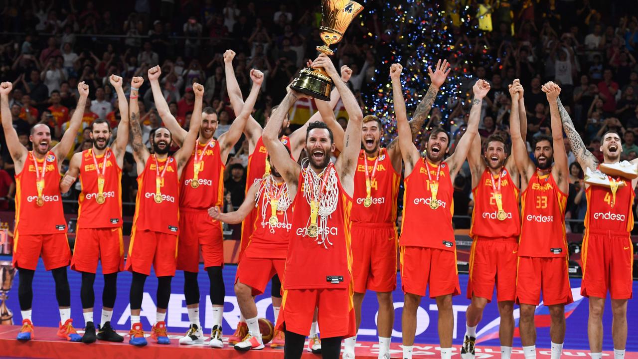 Spain's players celebrate with the trophy.