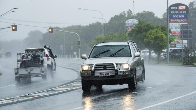 Cars driving through heavy rain at Mount Coolum as the big wet sets in on the Sunshine Coast. Picture: Lachie Millard.