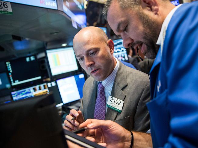 NEW YORK, NY - JUNE 24: A trader works on the floor of the stock exchange during the afternoon of June 24, 2015 in New York City. The Dow Jones Industrial Average plunged more than 150 points during debates over Greece's bailout. Andrew Burton/Getty Images/AFP == FOR NEWSPAPERS, INTERNET, TELCOS & TELEVISION USE ONLY ==