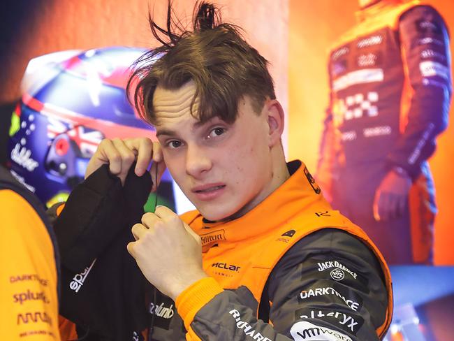 2023 Australian Grand Prix. Friday. Practice 2 Pits. McLaren driver Oscar Piastri removes his helmet after a wet Practice 2 in his pit garage. Picture: David Caird