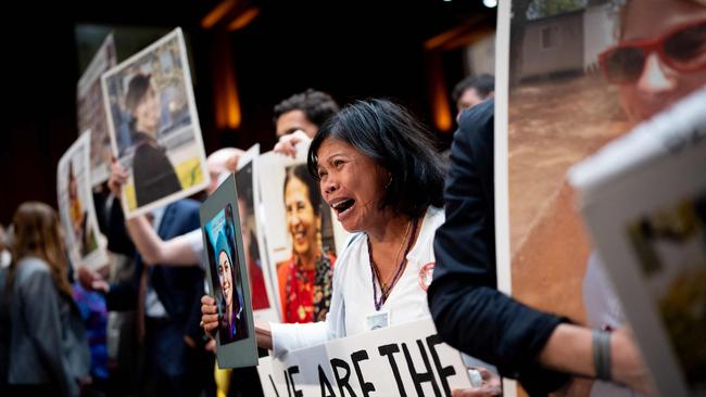 Clariss Moore holds a photograph of her daughter Danielle Moore and stands with other family members of those killed in the Ethiopian Airlines Flight 302 and Lion Air Flight 610. Picture: Getty