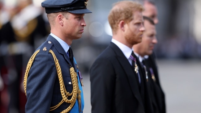 Prince William, Prince of Wales and Prince Harry, Duke of Sussex walk behind the coffin during the procession for the Lying-in State of Queen Elizabeth II on September 14, 2022 in London, England. Photo by Richard Heathcote/Getty Images.