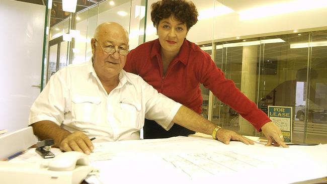 Norm and Lisa Martin discuss the plans of The Dunes Cotton Tree in 2003. Picture: Barry Leddicoat.