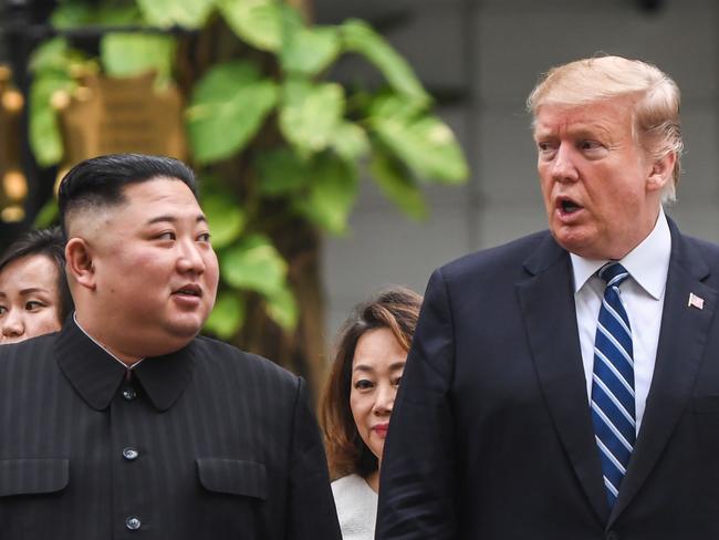 US President Donald Trump (R) walks with North Korea's leader Kim Jong Un during a break in talks at the second US-North Korea summit at the Sofitel Legend Metropole hotel in Hanoi on February 28, 2019. (Photo by Saul LOEB / AFP)