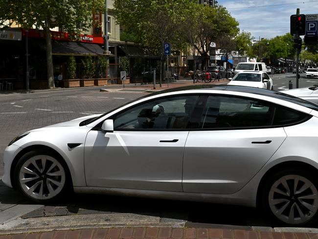 ADELAIDE, AUSTRALIA - NewsWire Photos October 20, 2022: Generic photos of electric cars and charging stations. Tesla on Gouger Street.Debate over repeal of electric vehicle levy to continue/ conclude in SA lower house. The tax forces electric vehicle owners to pay a 2.5 cent per kilometre mileage charge on zero-emission vehicles in lieu of the fuel excise not being paid. Axing the tax was an election promise of LaborÃs Peter Malinauskas. Picture: NCA NewsWire / Naomi Jellicoe