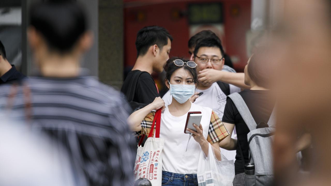 Mask are commonly now being worn around the Sydneys CBD due to the fear of the Coronavirus. Photo: Tim Pascoe