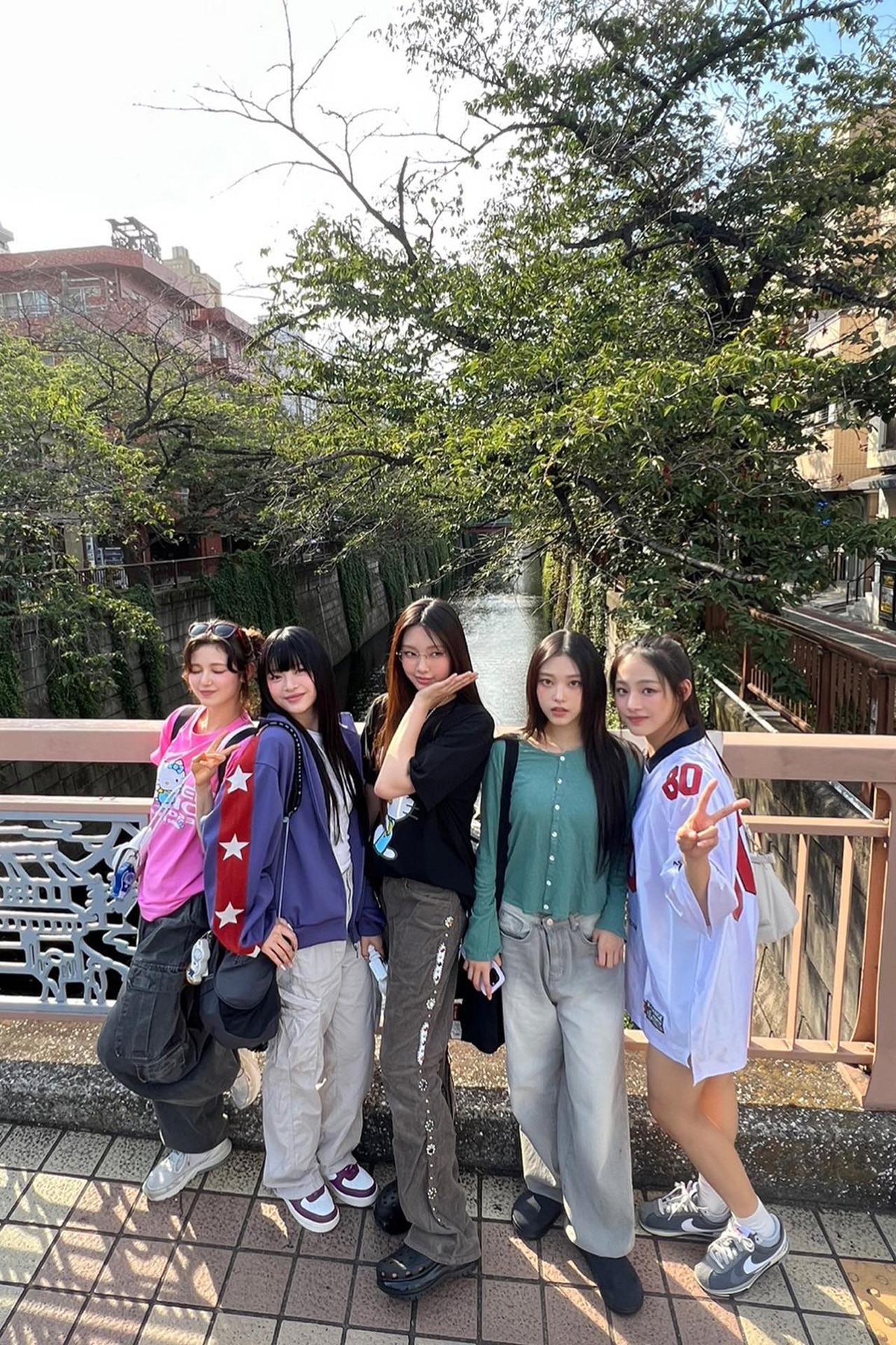 <p><em>Image credit: Instagram.com/newjeans_official.</em></p><p>(From left to right) Danielle wears Summer Sonic, Burberry and Nike. Hanni wears Kapital, &AElig; Synctx and Nike. Hyein wears Summer Sonic, Kapital, O!Oi collective and Crocs. Haerin wears Kapital, O!Oi collective and Klogg. Minji wears Calie, Coller and Nike. August 23 2023.&nbsp;</p>