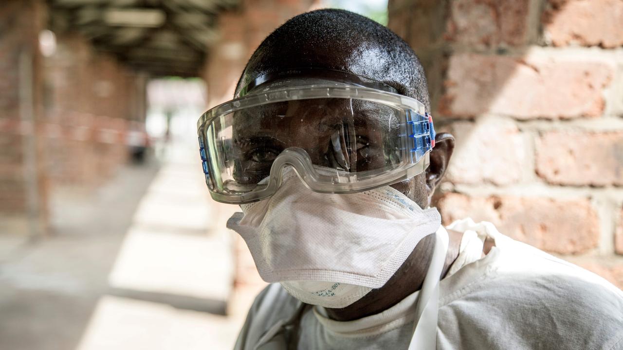 A health worker wears protective equipment as he looks on at Bikoro Hospital in the Democratic Republic of Congo. Picture: AFP