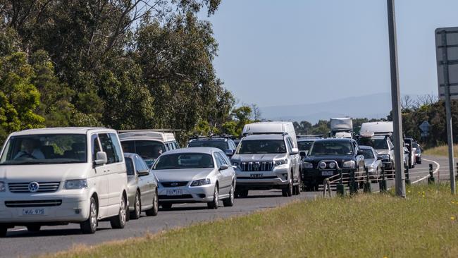 Cues near the former Lang Lang checkpoint this morning. Picture: Eric Eichin