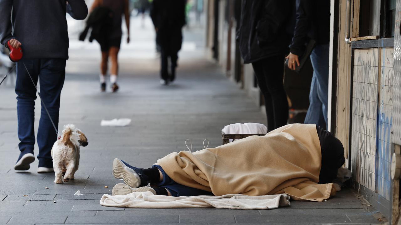 A homeless man sleeping rough on Oxford Street in Darlinghurst. New data shows there has been a 66 per cent increase in workers sleeping rough in the past two two years. Picture: Richard Dobson