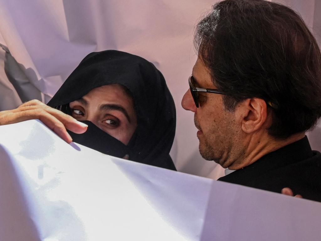 Former Pakistan prime minister Imran Khan and his wife Bushra Bibi arrive to appear at a high court in Lahore. Picture: Arif ALI / AFP