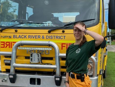 Hanna Johansson works alongside emergency crews in Ingham, helping clear debris and support local flood recovery efforts. Picture: Supplied