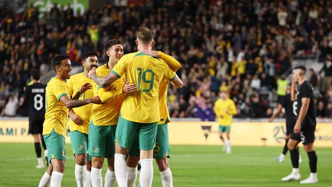 Harry Souttar celebrates with teammates after Australia opened the scoring. Picture: Getty