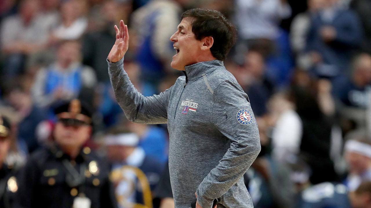 (FILES) In this file photo taken on November 14, 2018 Dallas Mavericks owner Mark Cuban interacts with fans as the Dallas Mavericks take on the Utah Jazz at American Airlines Center in Dallas, Texas. NOTE TO USER: User expressly acknowledges and agrees that, by downloading and or using this photograph, User is consenting to the terms and conditions of the Getty Images License Agreement. - Any NBA discipline of Mavericks owner Mark Cuban for his criticism of the league after a loss to Atlanta is reportedly on hold pending the Mavs' official protest of the February 22, 2020 result. The Mavericks filed a protest after their 111-107 loss to the Hawks citing a "misapplication of the rules" on a play with 8.4 seconds left and Atlanta leading by two points. (Photo by TOM PENNINGTON / GETTY IMAGES NORTH AMERICA / AFP)
