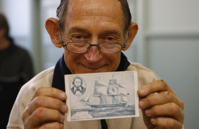 Then Post Card Collectors Society president John Sumner at the Postcard Collectors Society fair in Croydon in 2008 with his most expensive post card. It’s of Dunbar and he which he bought for $40.