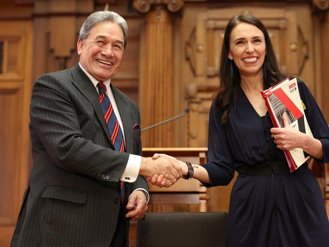 Jacinda Ardern and NZ First leader Winston Peters shake hands during a coalition agreement signing in 2017. Picture: Getty Images.