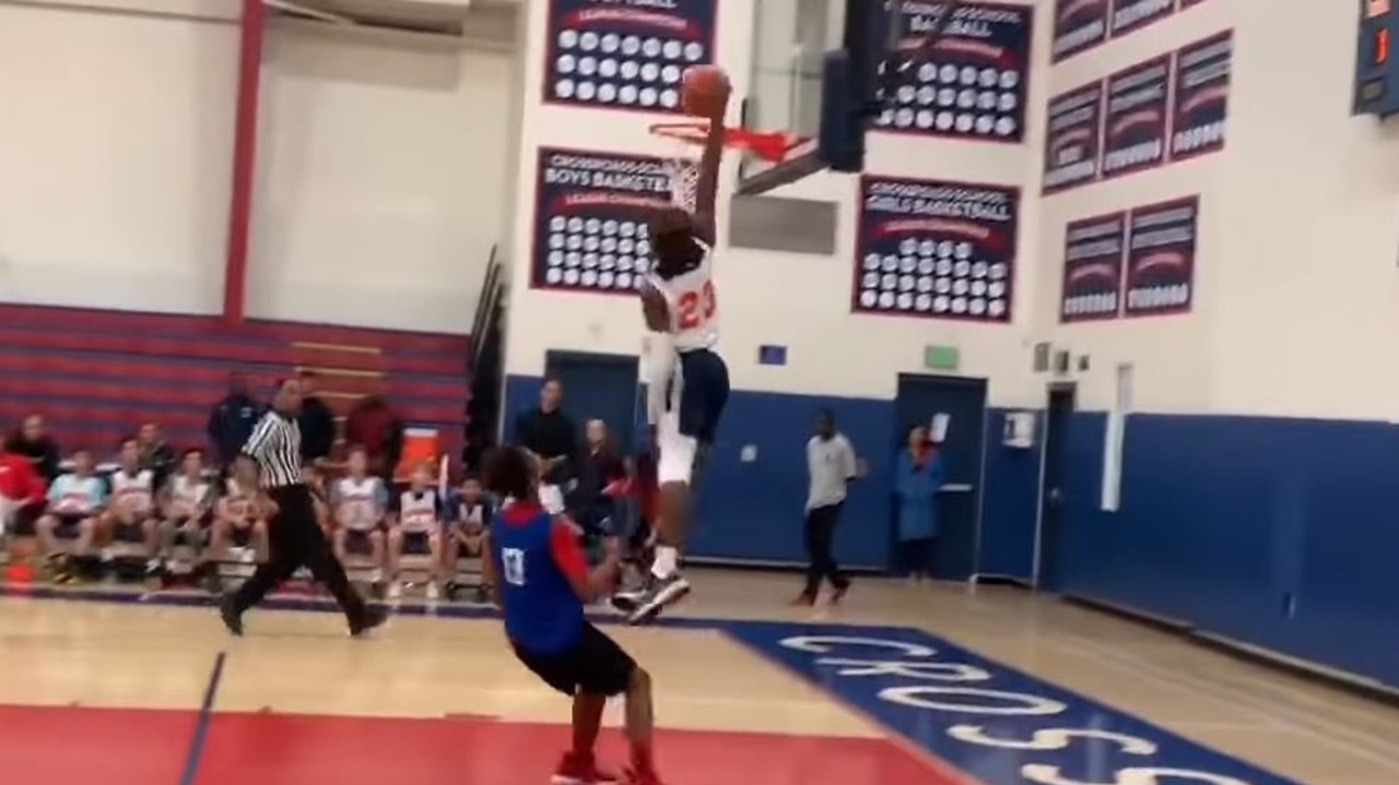 NBA news LeBron James Jr. Bronny James son of LeBron dunks and dominates first middle school game playing with son in NBA