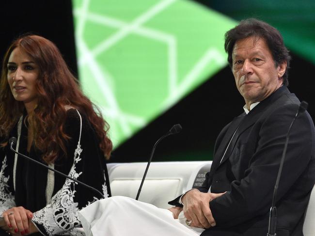 A picture taken October 23, 2018 shows Pakistani Prime Minister Imran Khan (R) waiting to take part in a discussion with a presenter during the opening ceremony of the Future Investment Initiative FII conference taking place in Riyadh from 23-25 October. - Saudi Arabia is hosting a key investment summit overshadowed by the killing of critic Jamal Khashoggi that has prompted a wave of policymakers and corporate giants to withdraw. (Photo by FAYEZ NURELDINE / AFP)