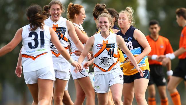 Calder Cannons players Jacinta Taylor, Lauren Caruso and Eleanor Cornish embrace after their side’s win over Bendigo Pioneers on Friday. Picture: Jack Thomas.