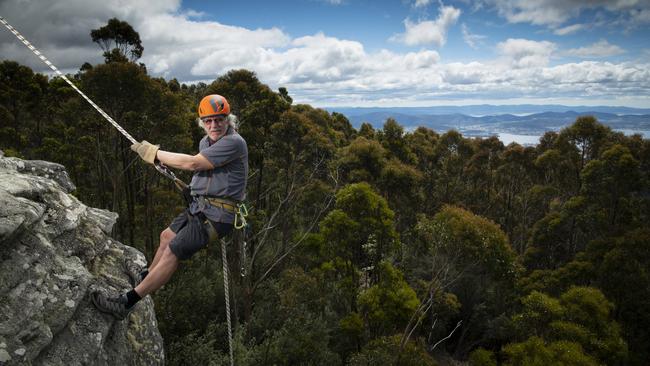 Philip Harris, who runs Aardvark Adventures, abseils near The Springs on Mount Wellington, Hobart. Picture: Matthew Newton