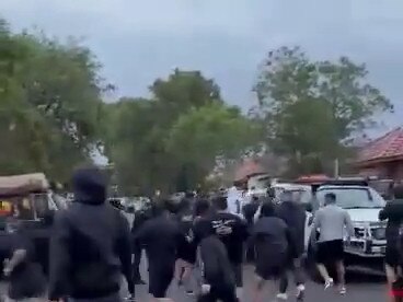 The riot squad was called after hundreds turned up to protest outside St Michael’s Church in Belfield. Picture: Facebook