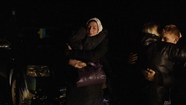 Oleksandr (L), 16, who was kept at a state boarding school in Russian-occupied Lugansk, hugs his aunt Viktoria, 47, after he crossed the border from Belarus to Ukraine. Picture: AFP