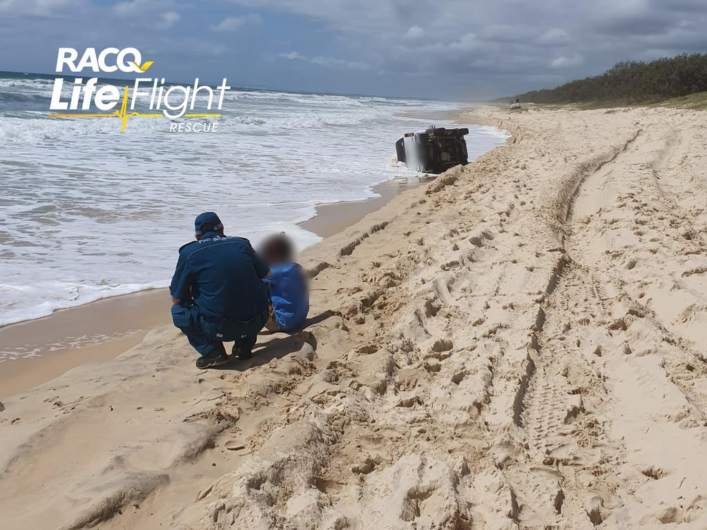 Two young boys have been flown to hospital with neck injuries after the car they were travelling in rolled over on a Queensland beach. Picture: Supplied by RACQ LifeFlight Rescue