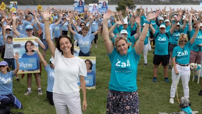 Independent MP for Warringah Zali Steggall (right) and independent candidate for Mackellar Sophie Scamps with their supporters at Dee Why. Picture: Supplied