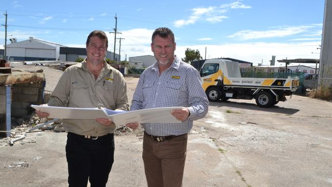 BM Webb Industrial Property sales manager Jeff Turner and operations manager Adam Beasley look at plans for a proposed showroom project in Woolcock St, Garbutt.