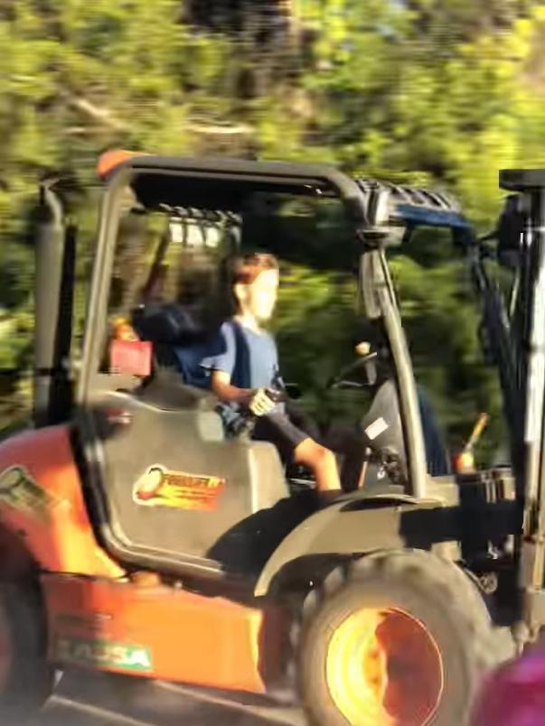 Klay Stevenson, 10, comes in second in a forklift race with dad Brent at the Barra Fun Park in Townsville over the weekend.