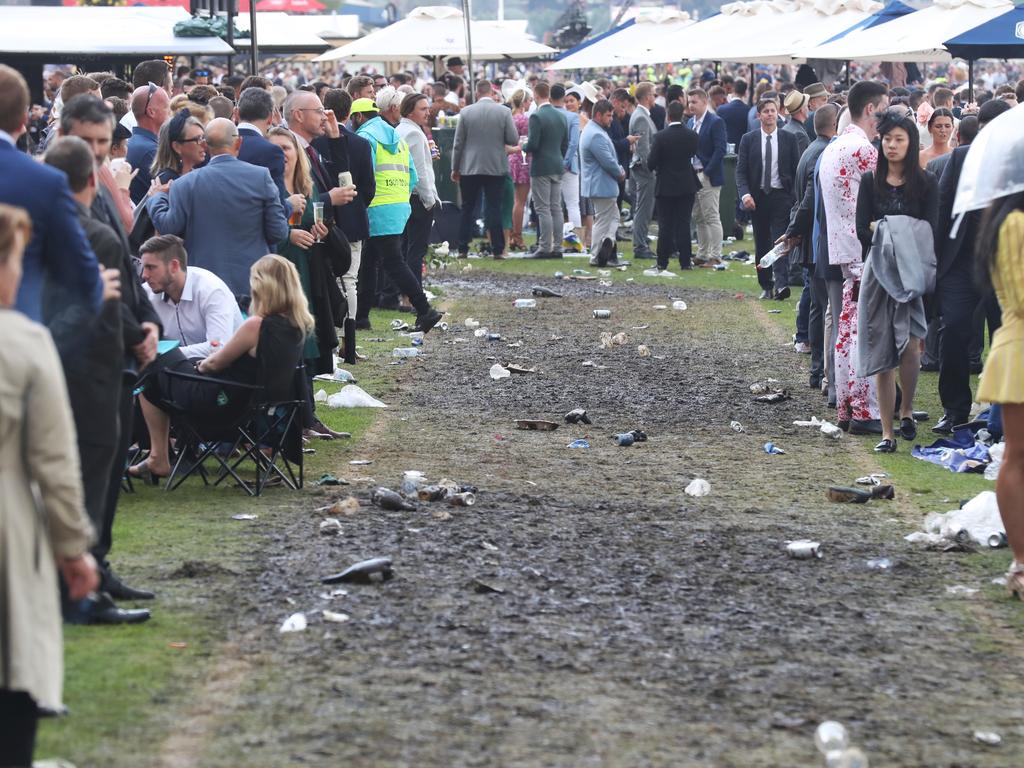 Racegoers are seen at the end of the Lexus Melbourne Cup Day, as part of the Melbourne Cup Carnival, at Flemington Racecourse in Melbourne, Tuesday, November 6, 2018. (AAP Image/Dave Crosling) NO ARCHIVING, EDITORIAL USE ONLY