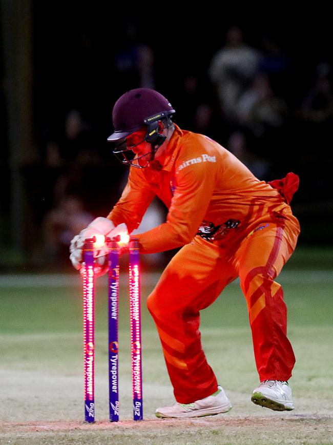 Barrier Reef Big Bash Game 1: Badgers v Hurricanes at Griffiths Park. Badgers' keeper Angus Warnock knocks the bails off to run out Hurricanes' Linden March. Picture: Stewart McLean