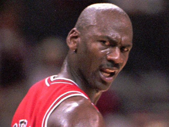 11/02/1998. Chicago Bulls' Michael Jordan looks back at an official after he was hacked on the arm but no foul was called during the second quarter against the Charlotte Hornets, in Charlotte, N.C. (AP Photo/Rick Havner). Basketball