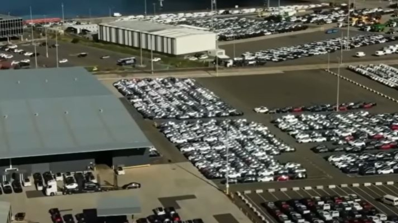 A parking lot in Port Melbourne full of unsold Teslas. (7News)