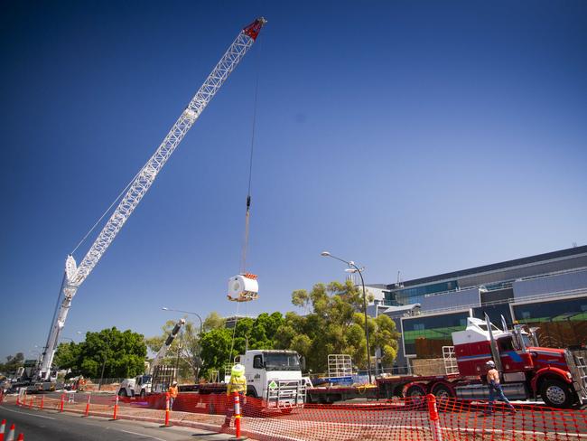 A 7.5 tonne MRI machine is craned into level five of the new Royal Adelaide Hospital. Picture: Nick Clayton