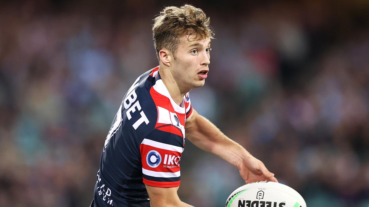 Sam Walker runs the ball for the Roosters