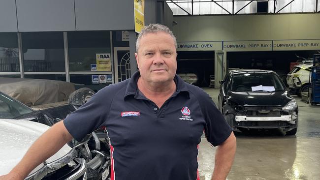 Glenn Forbes, owner of Plympton Crash Repairs, said his workshop was flooded with sewage following a sinkhole on his street. Picture: Evangeline Polymeneas