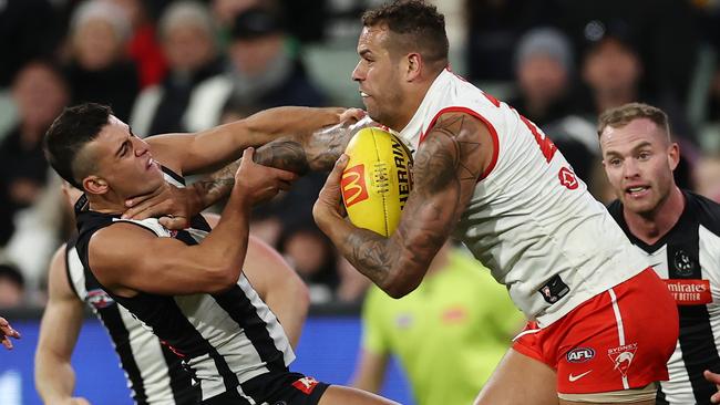 Lance Franklin fends off Nick Daicos. Picture: Michael Klein