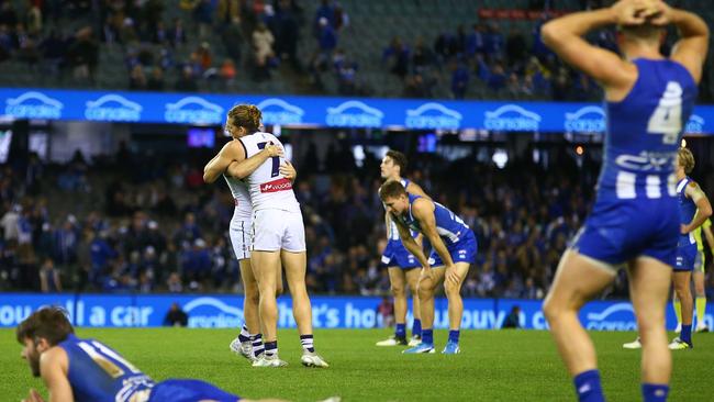 North Melbourne and Fremantle players react after the siren. Picture: Getty Images