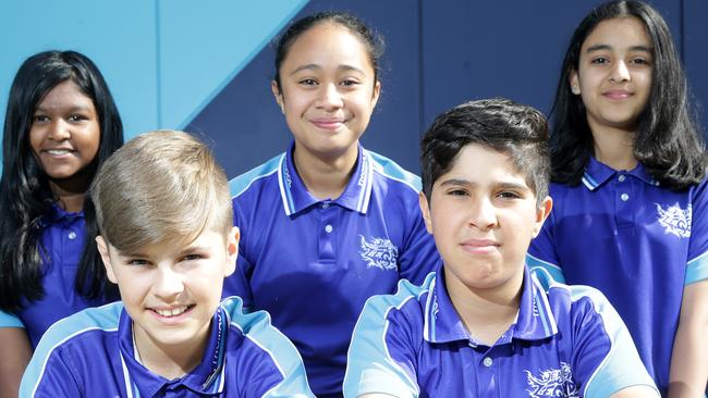 Thomastown East Primary School’s students (front row) Adam, Wally, (back row) Shahana, Retta and Joana are pretty pleased by their school’s 13.9 per cent improvement in NAPLAN results. Picture: Norm Oorloff