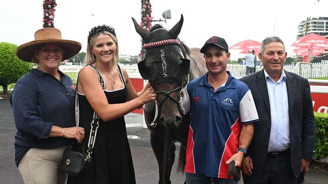 Trainers Tony Sears (far right) and Maddy Sears (second from left) celebrate the win of Beau Dazzler at Eagle Farm. Picture: Grant Peters/Trackside Photography