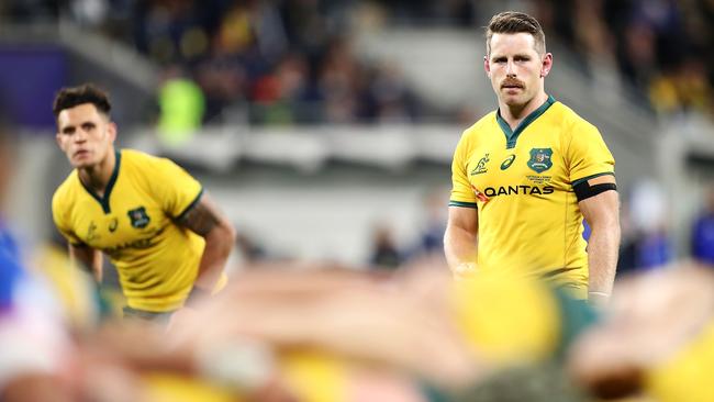 Matt To’omua and Bernard Foley of the Wallabies watches on as a scrum packs.