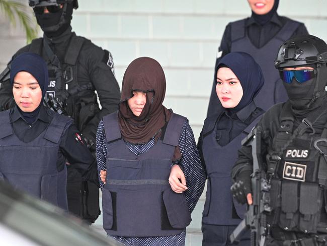 Vietnamese national Doan Thi Huong is escorted by Malaysian police after a court hearing in Kuala Lumpur this week. Picture: AFP