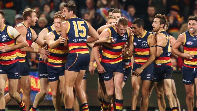 Adelaide players congratulate teammate Reilly O'Brien. (Photo by Morne de Klerk/Getty Images)