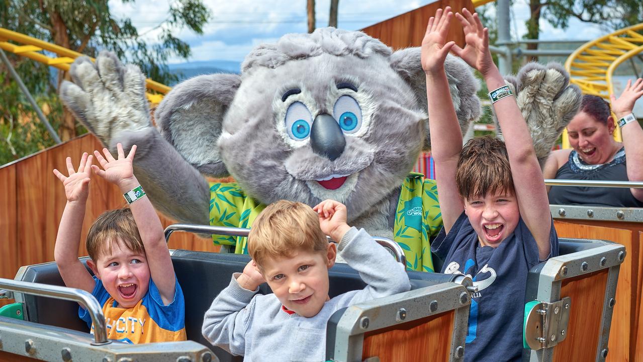 Gumbuya World with the Gumbo mascot and kids.