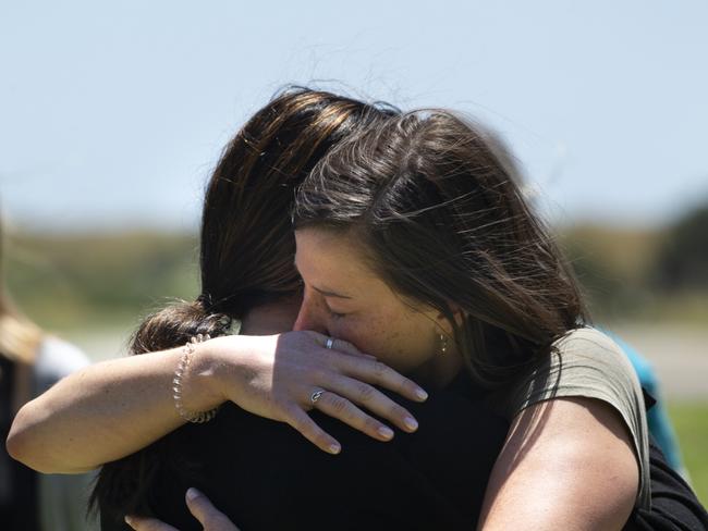 Women hugging and remembering those affected and killed by the White Island event. Picture: Brett Phibbs