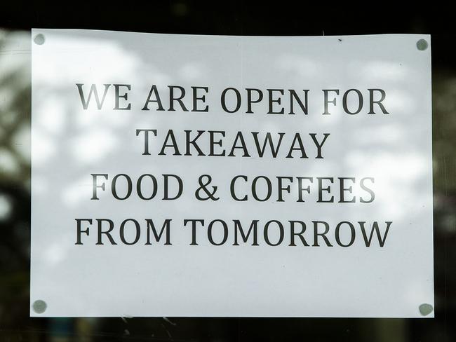 SYDNEY, AUSTRALIA - MARCH 23: A sign is seen in the window of a cafe on Bronte Road at Bronte Beach on March 23, 2020 in Sydney, Australia. From midday Monday, venues such as bars, clubs, nightclubs, cinemas, gyms and restaurants, along with anywhere people remain static would be closed. Schools remain open but parents have the option to keep children at home if they wish while Victoria is bringing forward school holidays from Tuesday. There are now 1353 confirmed cases of COVID-19 in Australia and the death toll now stands at seven. (Photo by Jenny Evans/Getty Images)